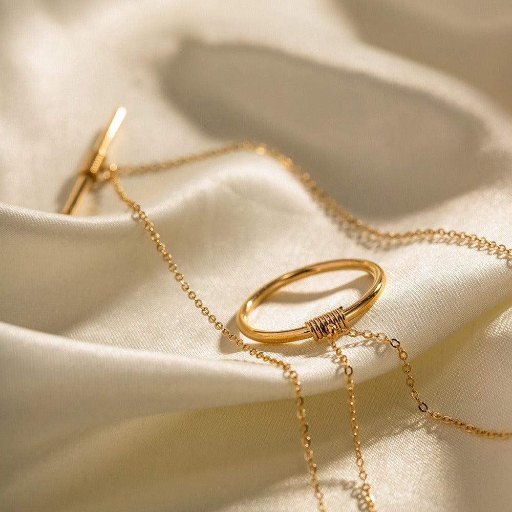 amethyst & sable axis balance necklace in 18k gold on satin surface