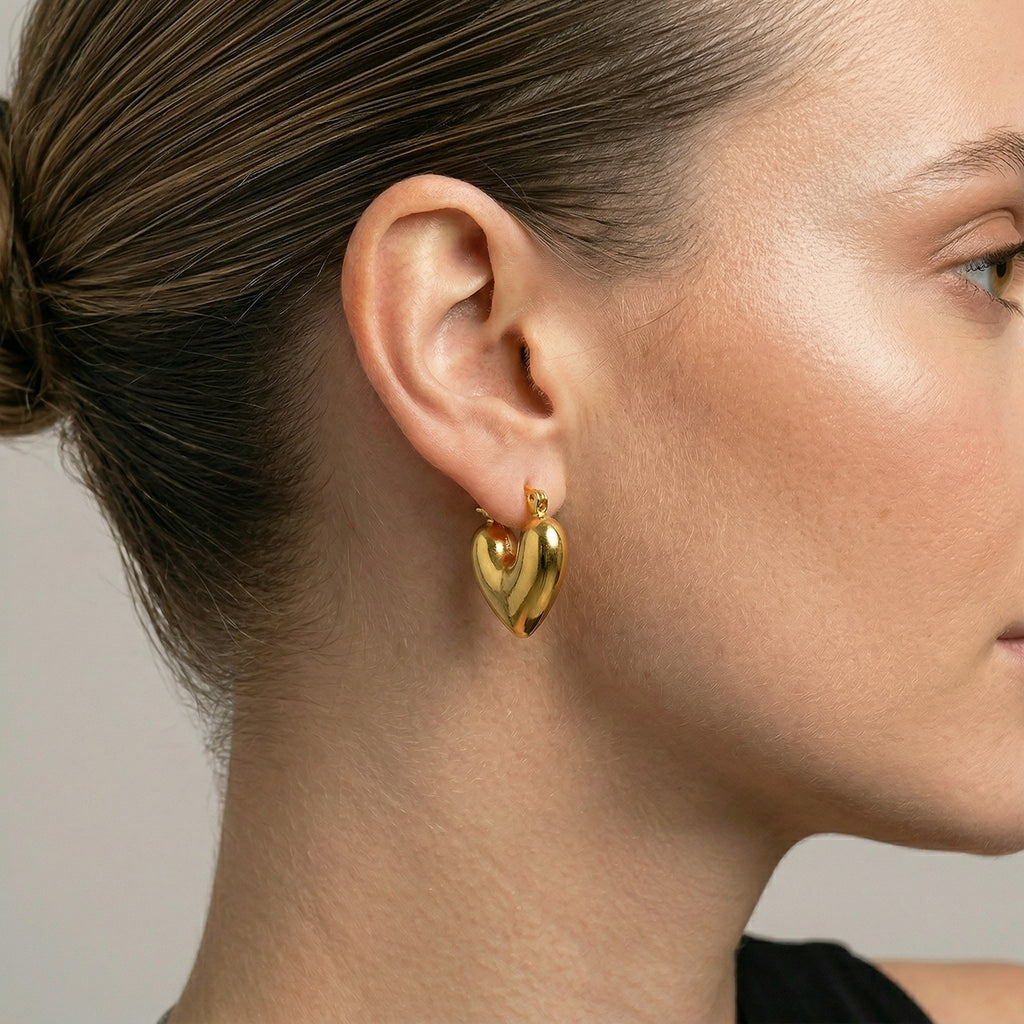 model wearing amethyst & sable aurea amour earrings in gold
