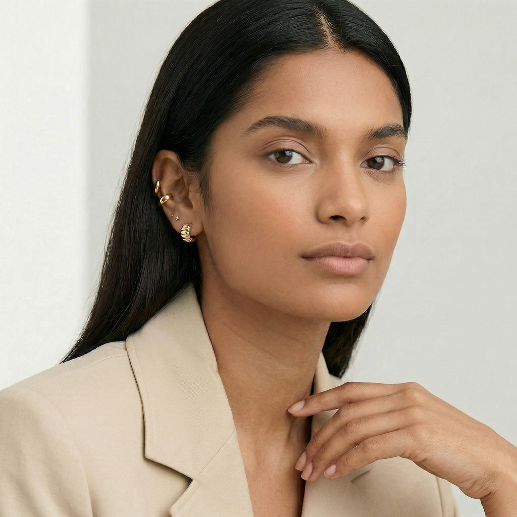 model wearing amethyst & sable aurea c-hoop earrings in gold