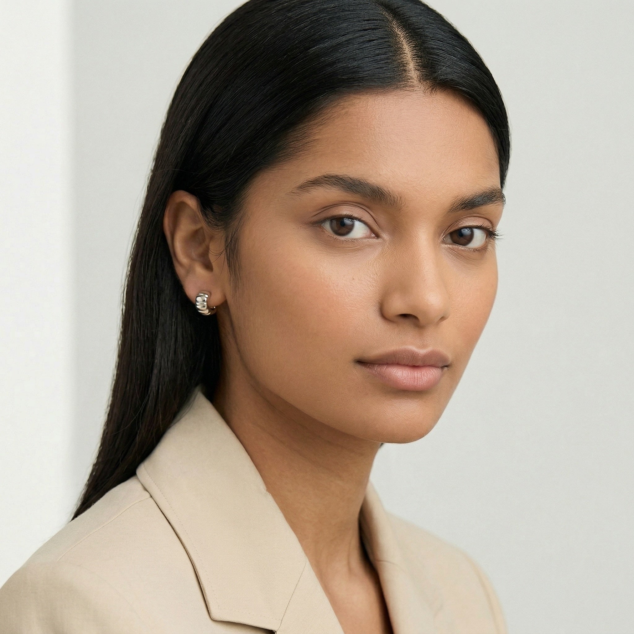 model wearing amethyst & sable aurea c-hoop earrings in silver