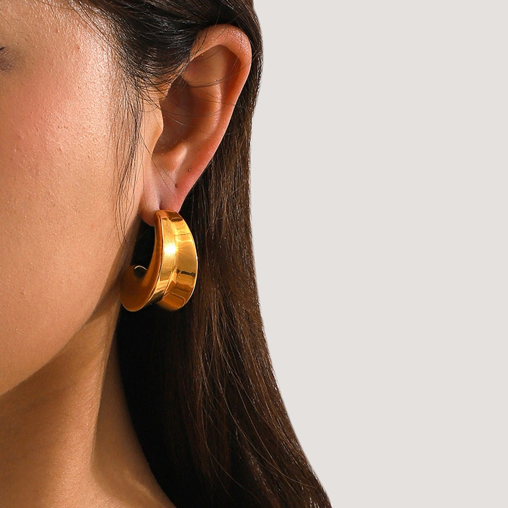 model wearing amethyst & sable aurea crescent hoop earrings in 18k gold