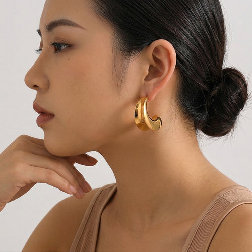 model wearing amethyst & sable aurea crescent hoop earrings in 18k gold