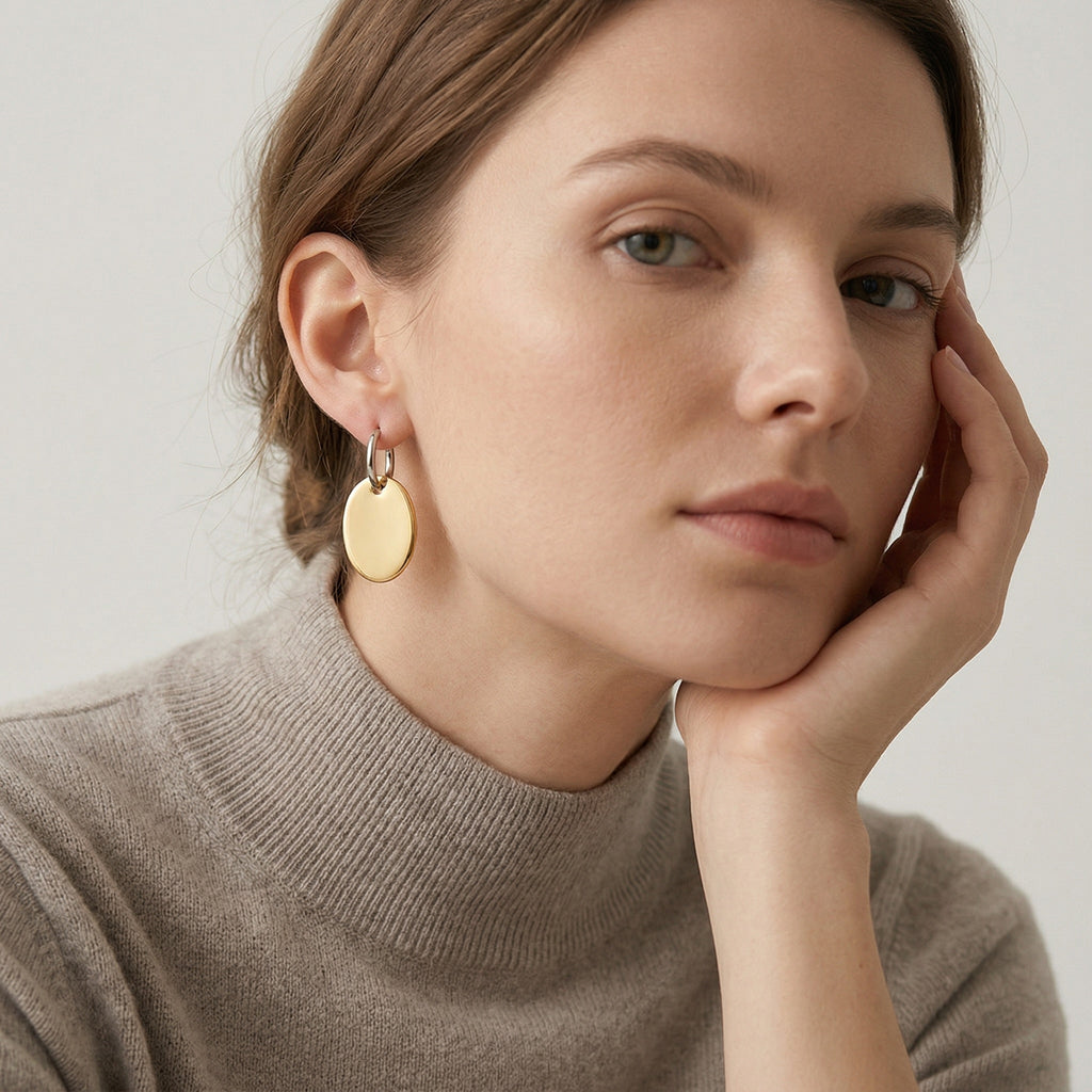 model wearing amethyst & sable aurea disc drop earrings in 18k gold