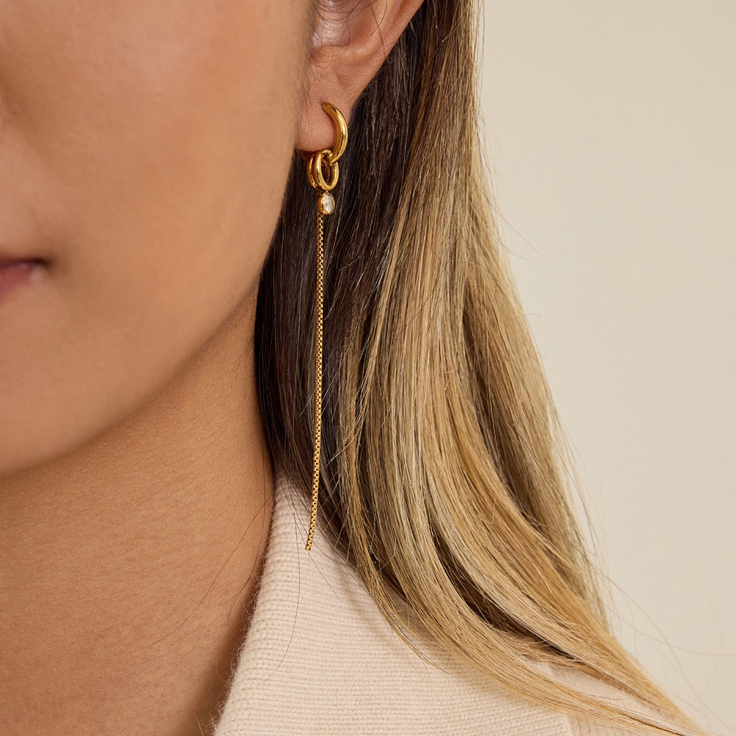 model wearing amethyst & sable aurea drop earrings in 18k gold