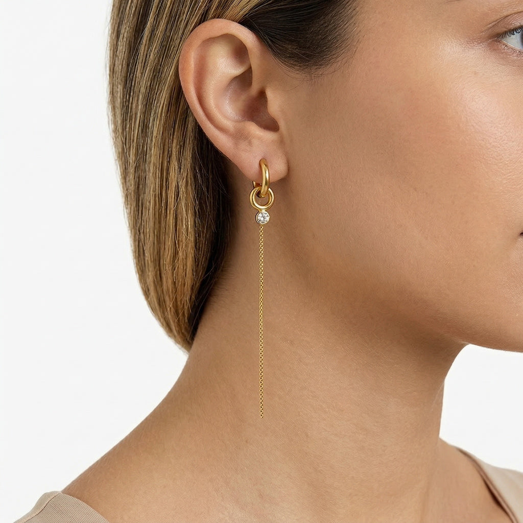 model wearing amethyst & sable aurea drop earrings in 18k gold