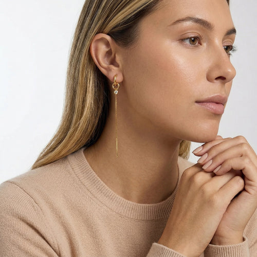 model wearing amethyst & sable aurea drop earrings in 18k gold