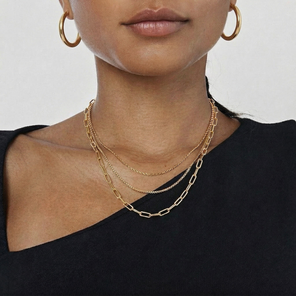 model wearing amethyst & sable aurea layered necklace in 18k gold