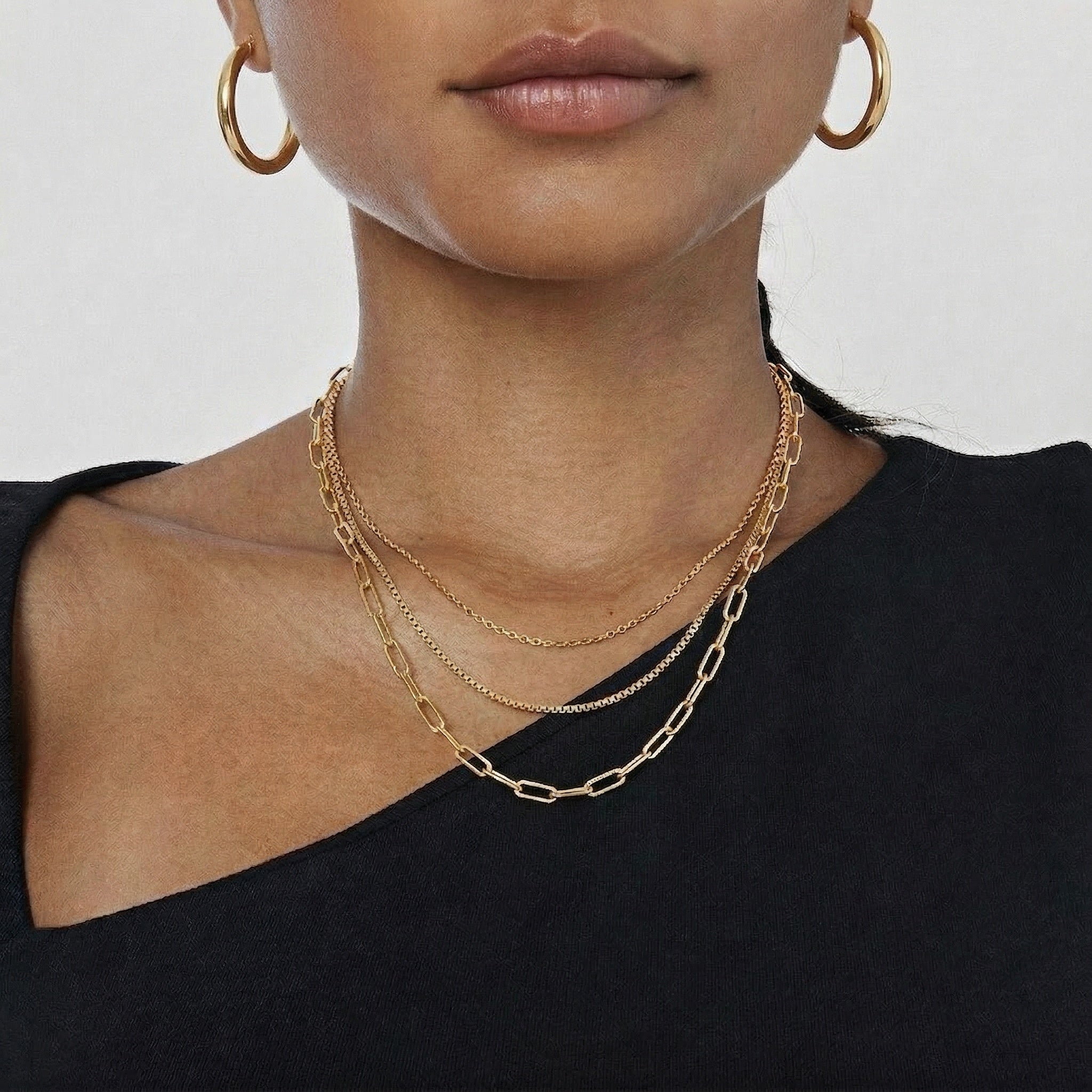 model wearing amethyst & sable aurea layered necklace in 18k gold