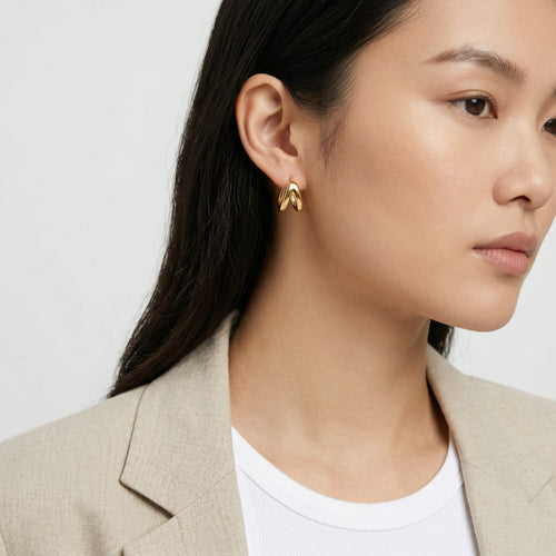 model wearing amethyst & sable aurea sculpted hoop earrings in 18k gold