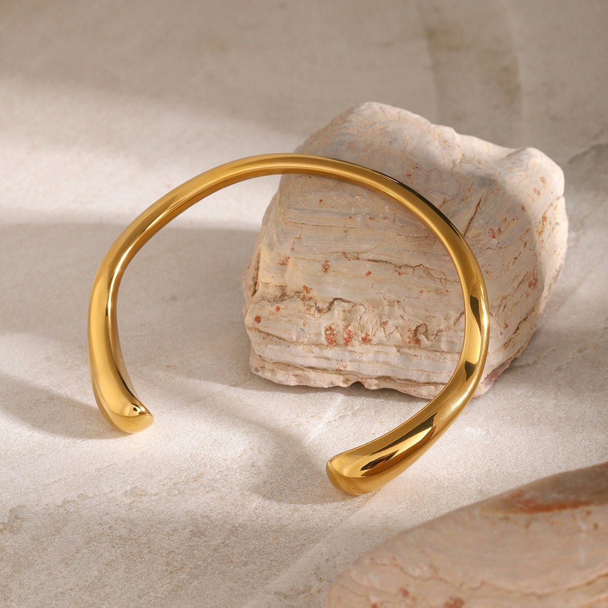 amethyst & sable axis arc cuff in 18K gold on stone