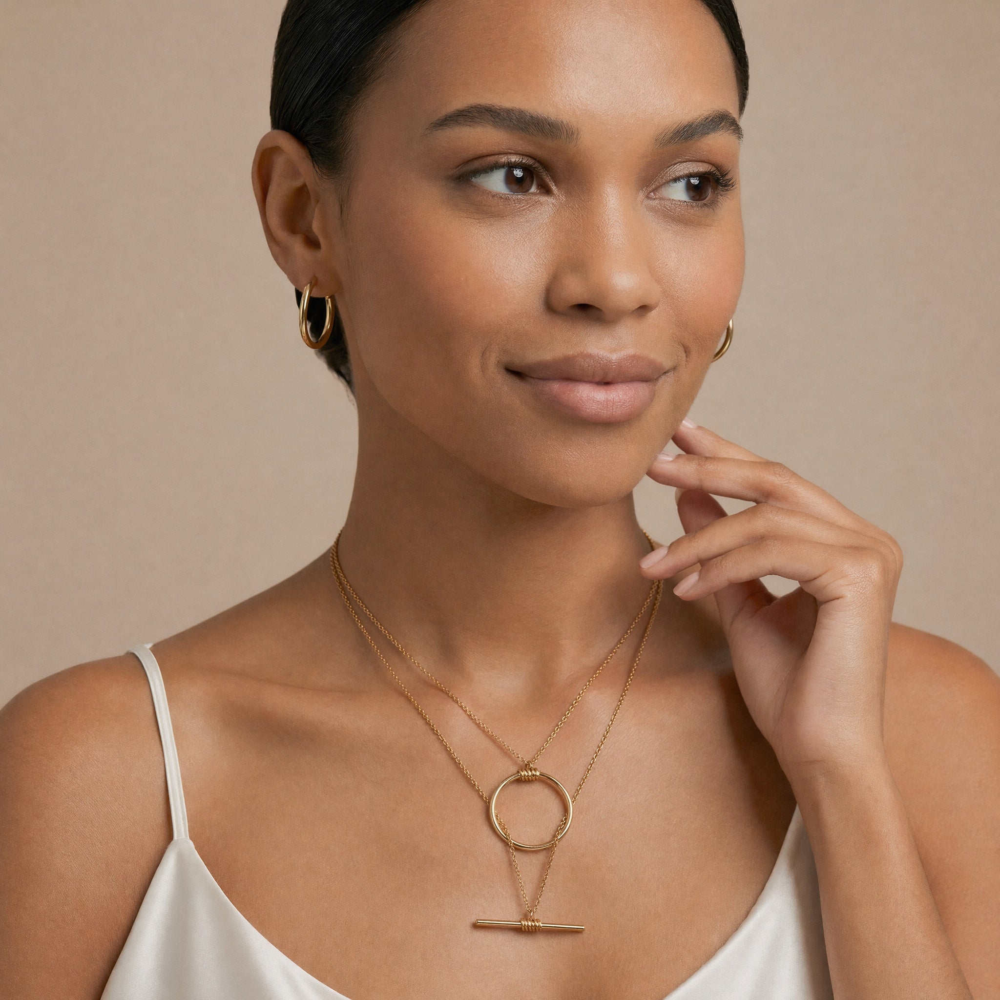 model wearing amethyst & sable axis balance necklace in 18k gold