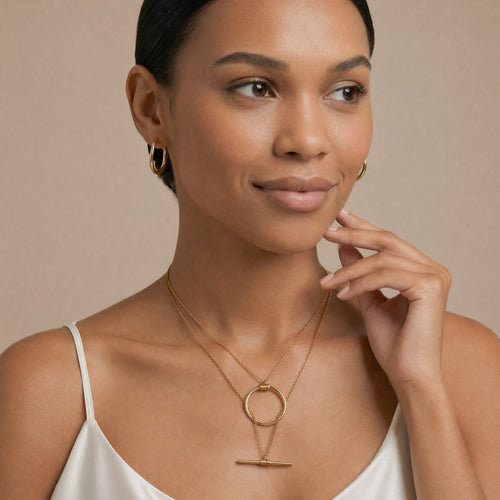 model wearing amethyst & sable axis balance necklace in 18k gold