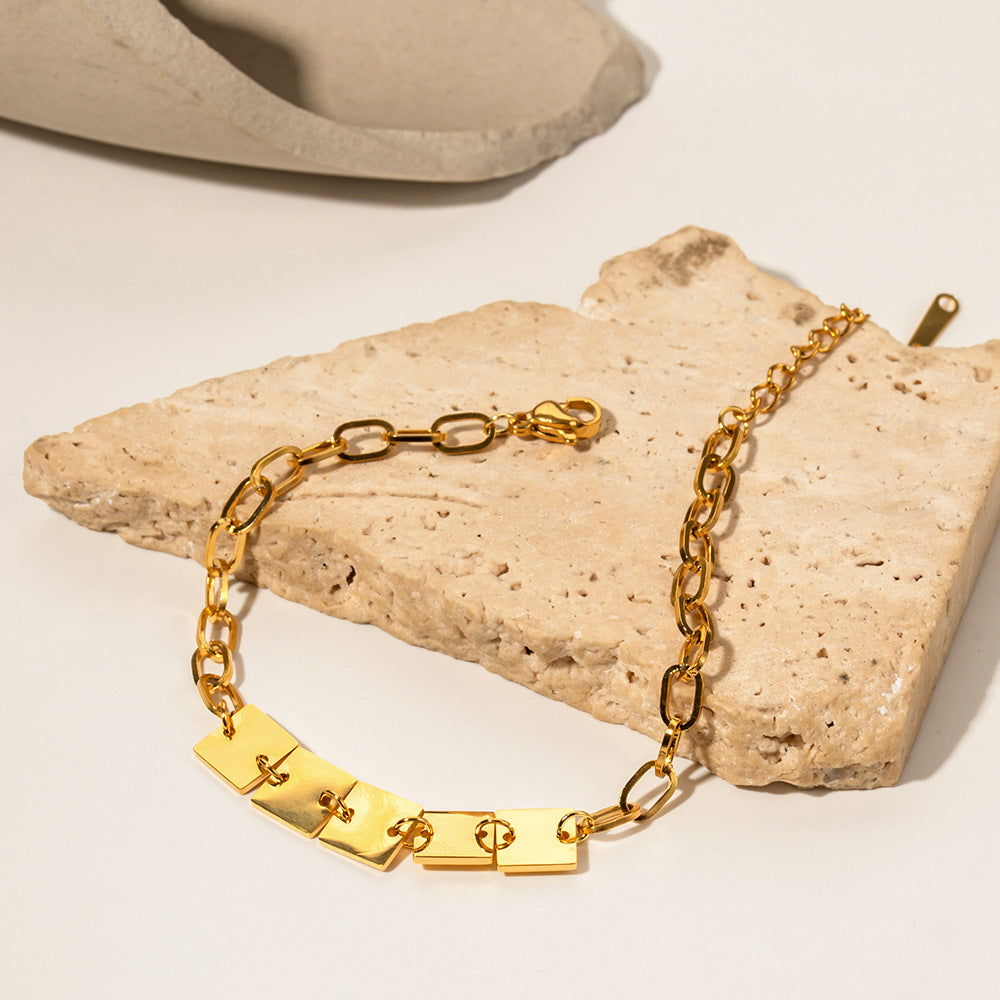 amethyst & sable axis facet bracelet in 18k gold on stone surface
