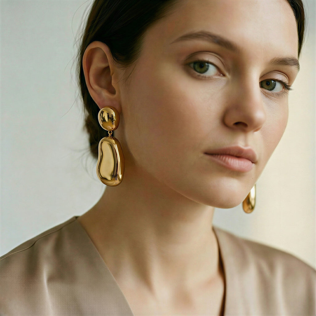 model wearing amethyst & sable axis form drop earrings in gold