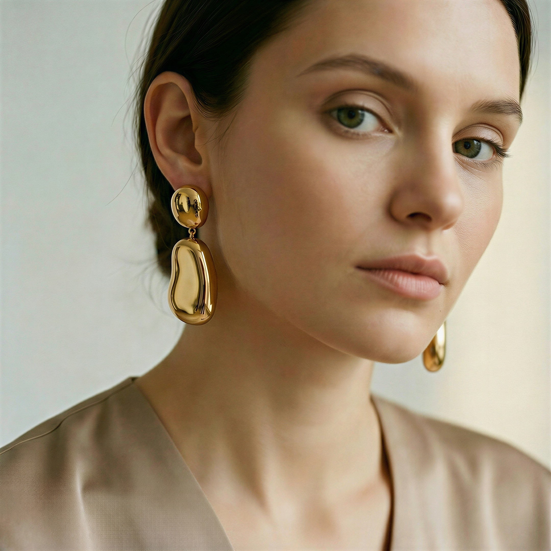 model wearing amethyst & sable axis form drop earrings in gold