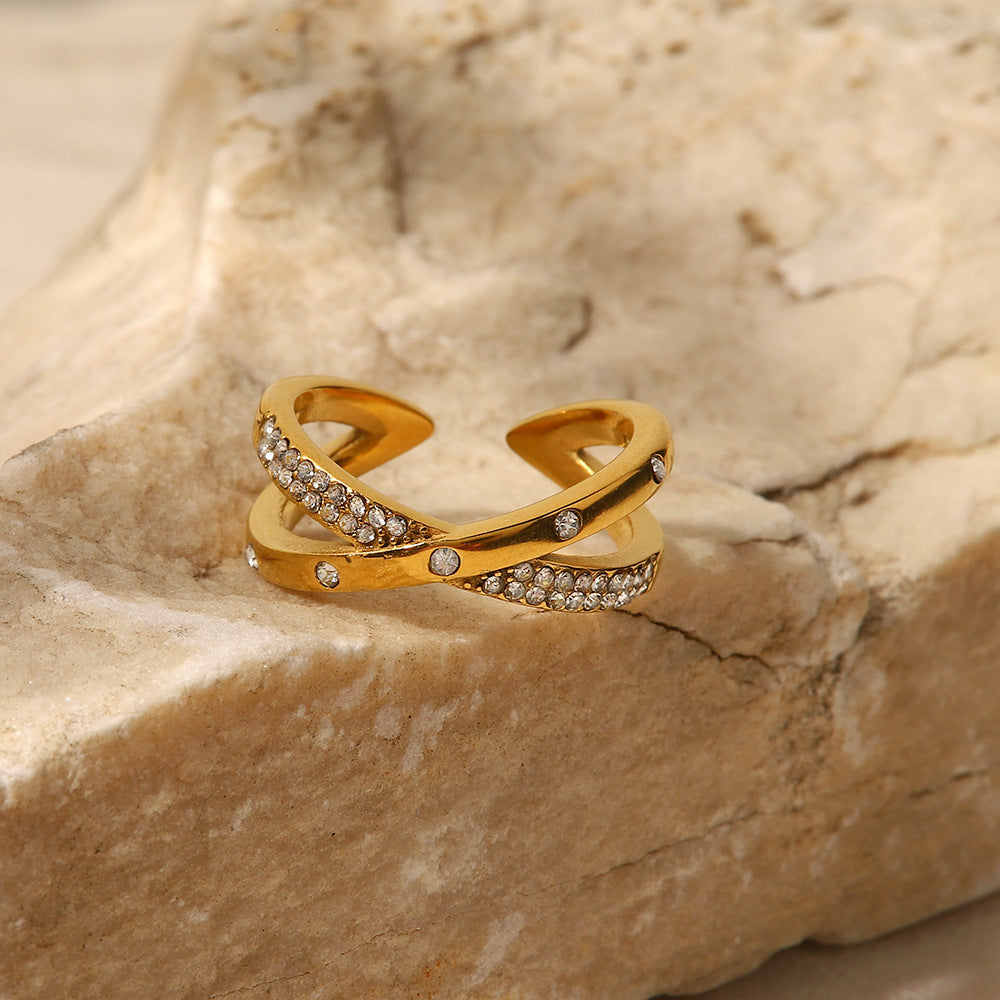 amethyst & sable axis interlace ring with diamond accents in 18k gold on stone surface