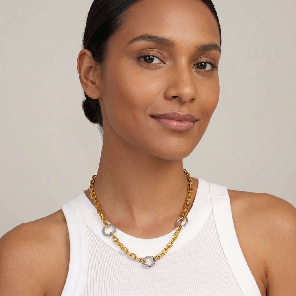 model wearing amethyst & sable two tone axis relay necklace in 18k gold and stainless steel