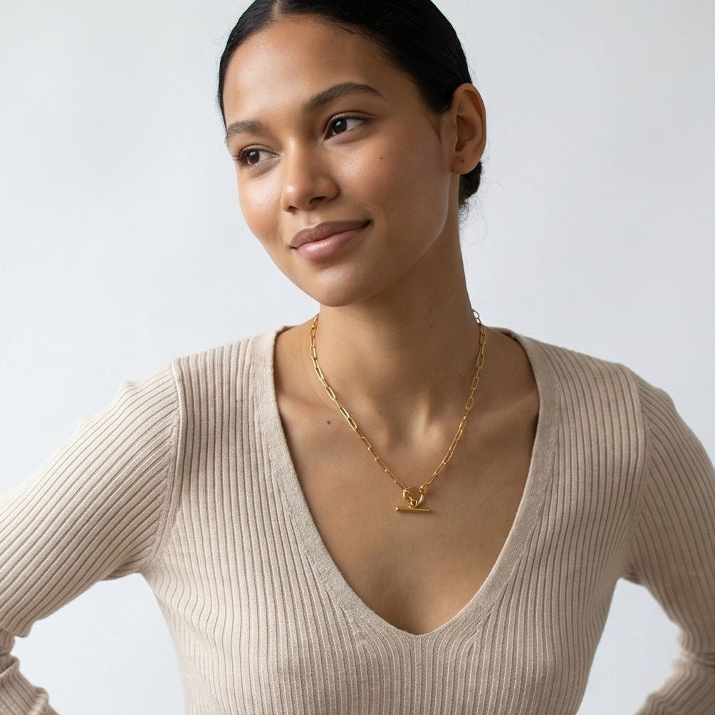 model wearing amethyst & sable axis toggle necklace in 18k gold