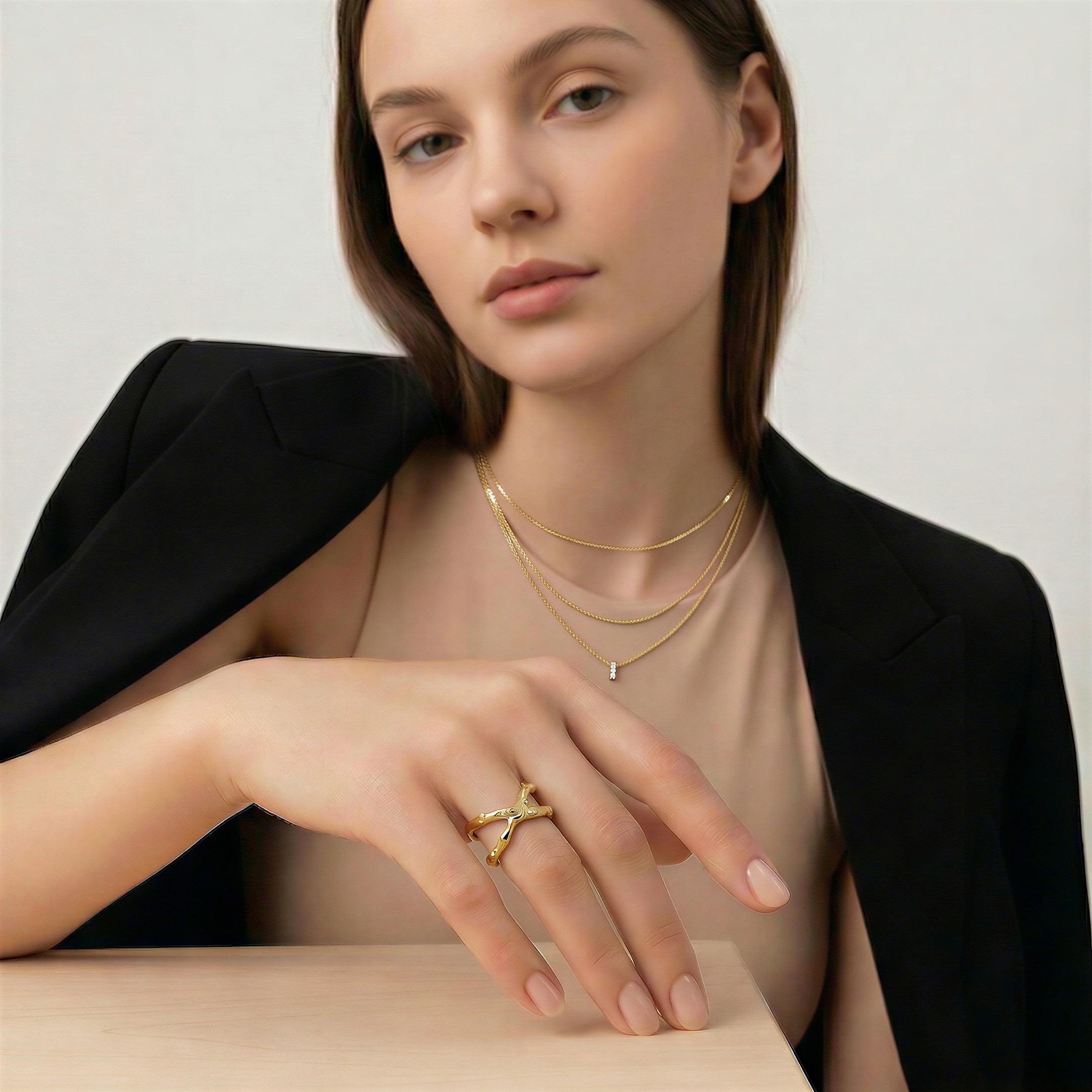 model wearing amethyst & sable calypso coral ring in 18k gold