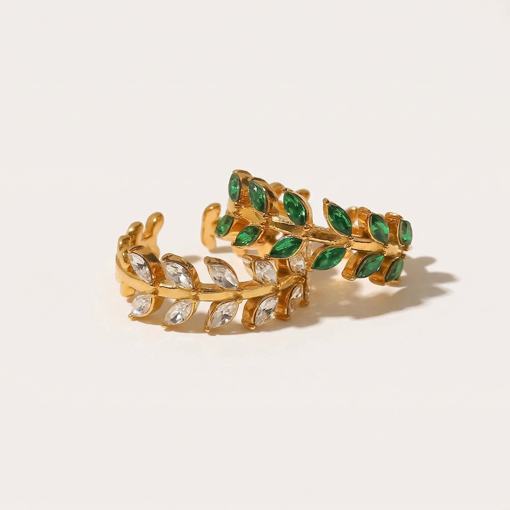 amethyst & sable calypso fern rings in 18k gold crystal and emerald
