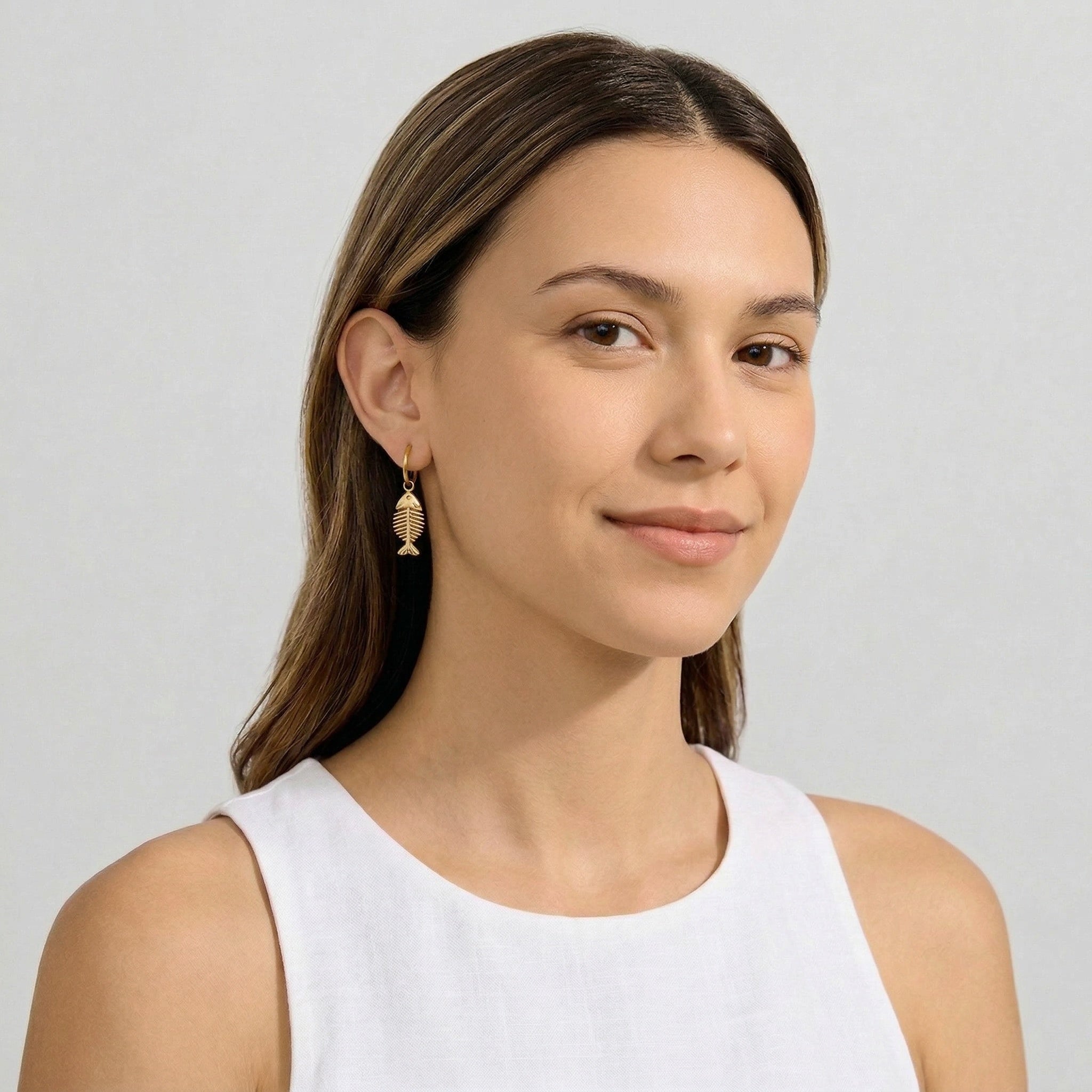 model wearing amethyst & sable Calypso Marina Drop Earrings in 18k gold