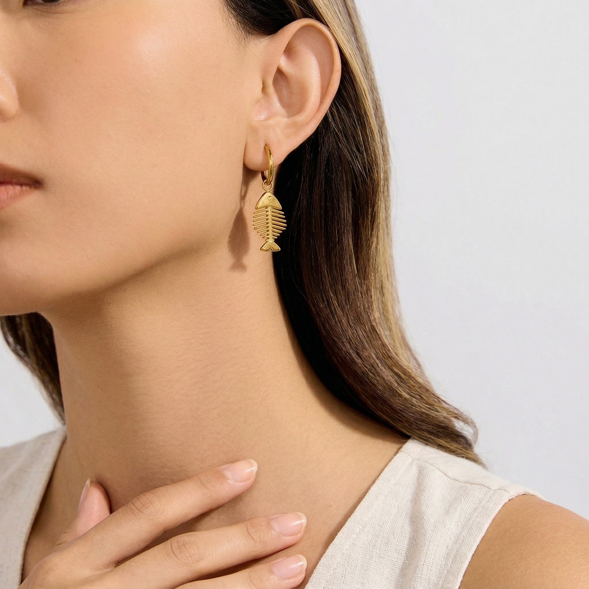 model wearing amethyst & sable Calypso Marina Drop Earrings in 18k gold