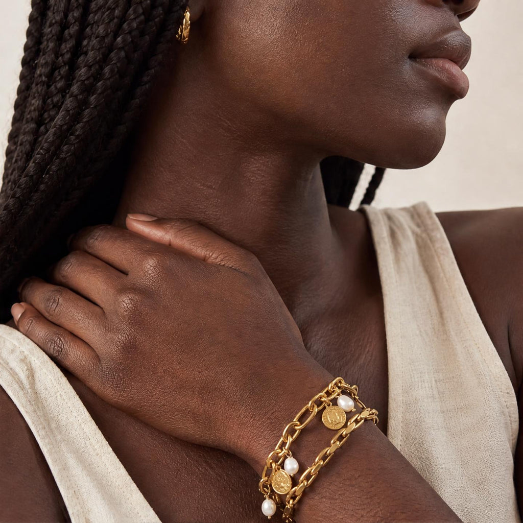 close-up of model wearing the amethyst & sable calypso marina stack bracelets