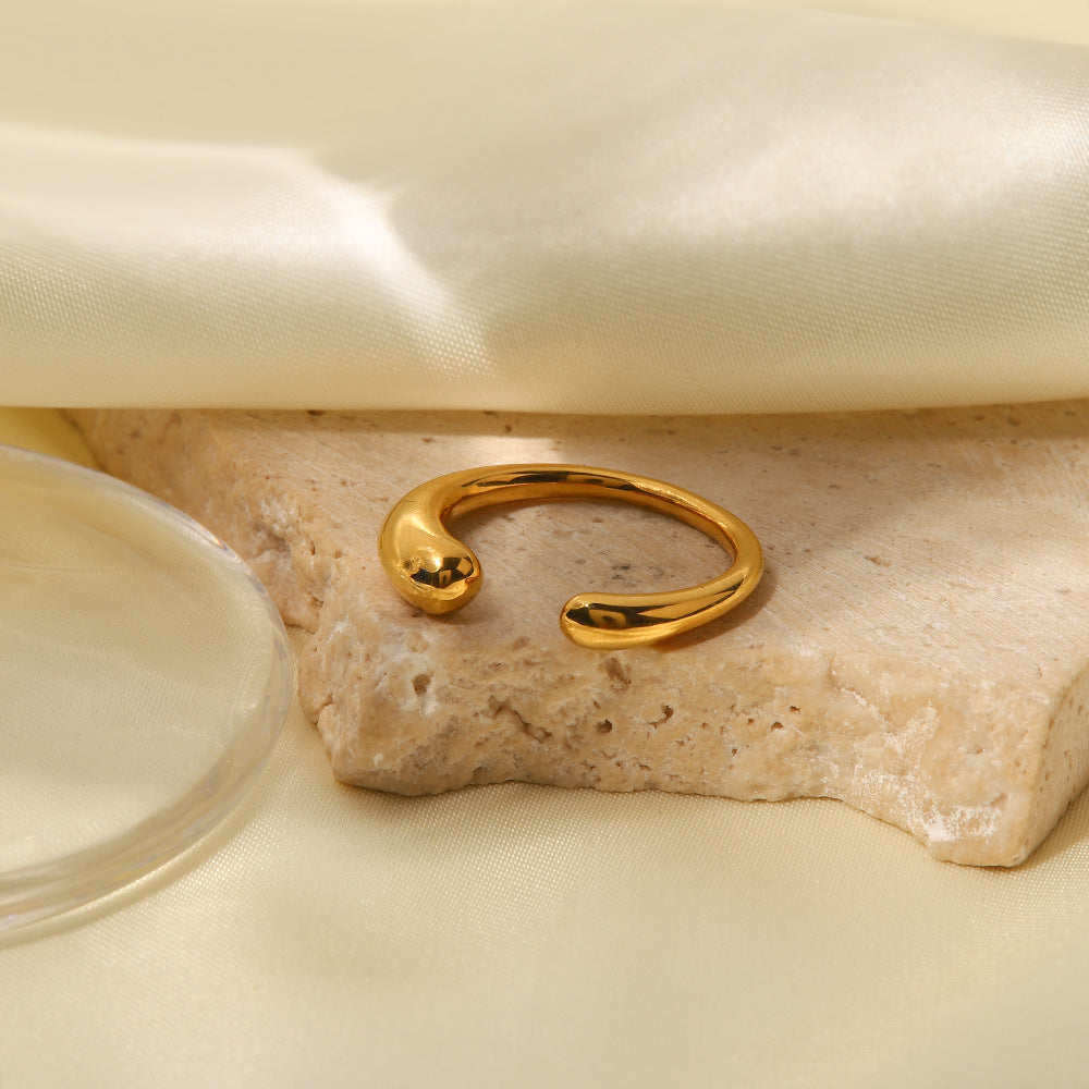 amethyst & sable luma aura open ring in 18k gold on stone surface