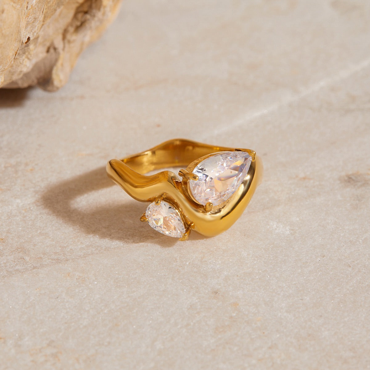 amethyst & sable luma duet ring in 18k gold on stone surface