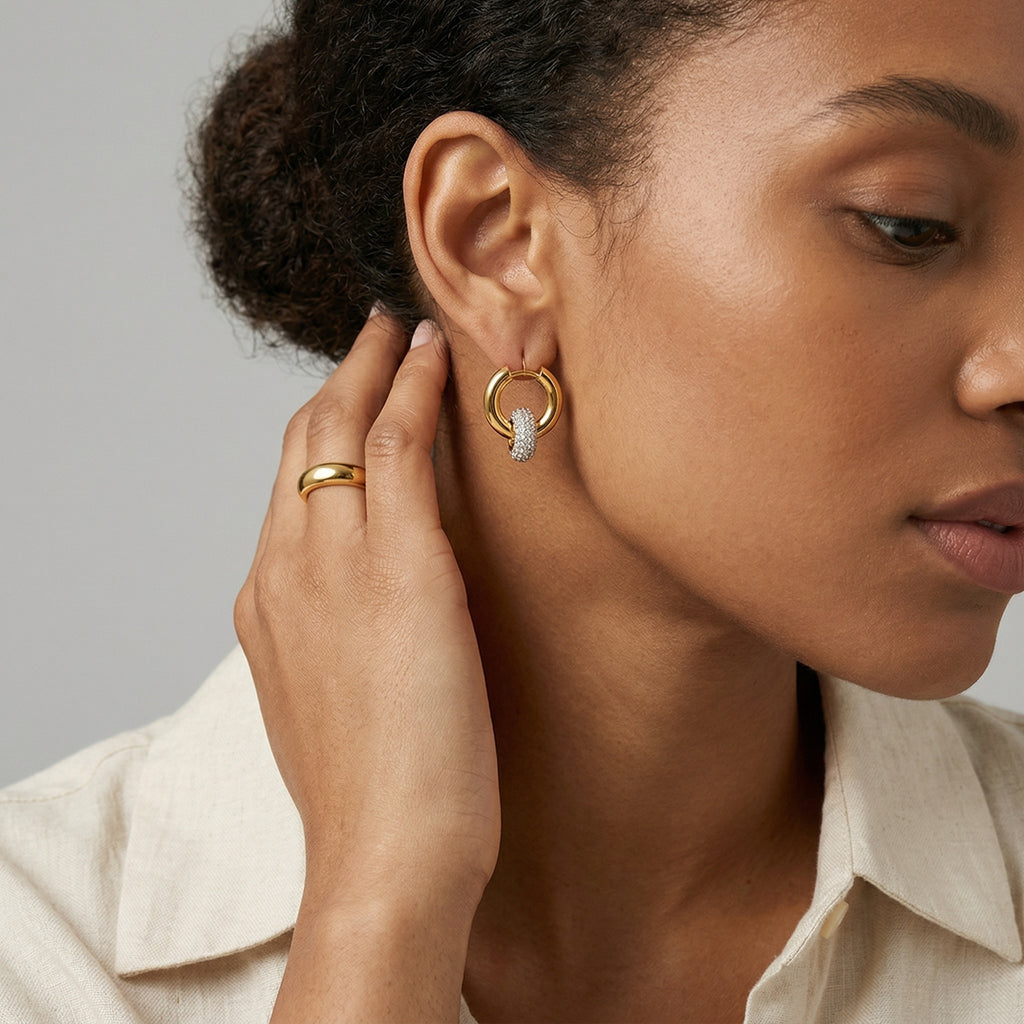 model wearing amethyst & sable luma halo drop earrings in 18k gold