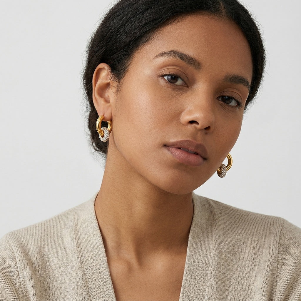model wearing amethyst & sable luma halo drop earrings in 18k gold