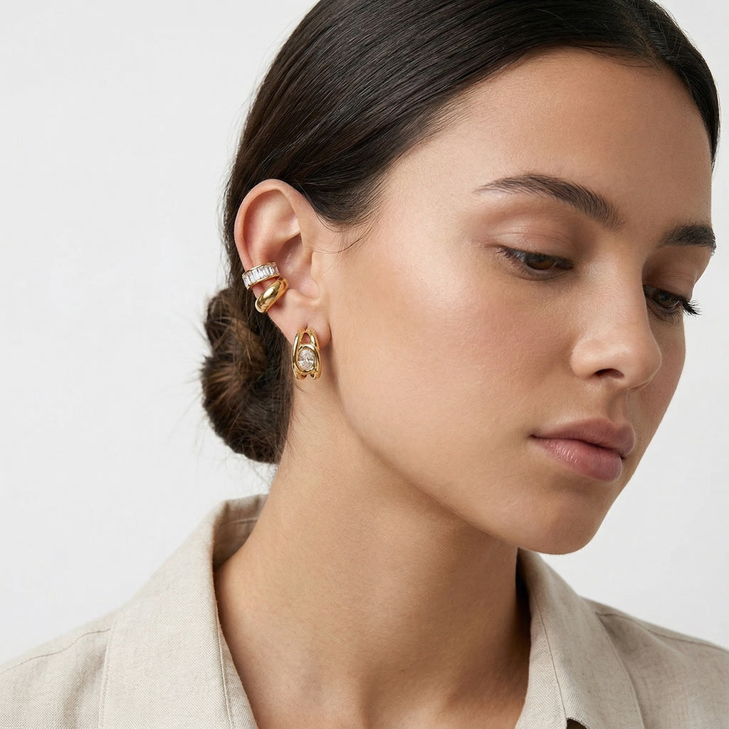 model wearing amethyst & sable luma halo ear stack in 18k gold
