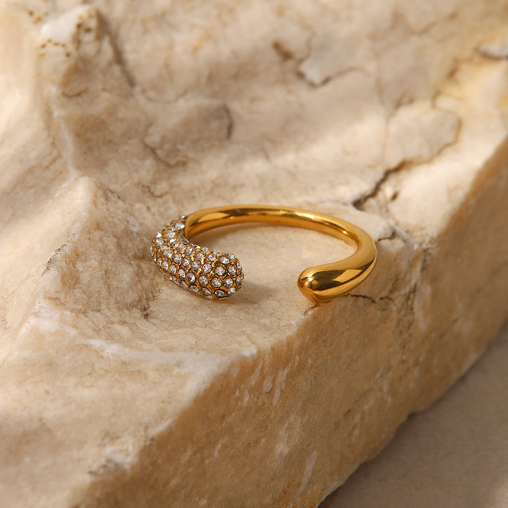amethyst & sable luma halo open ring in 18k gold on stone surface