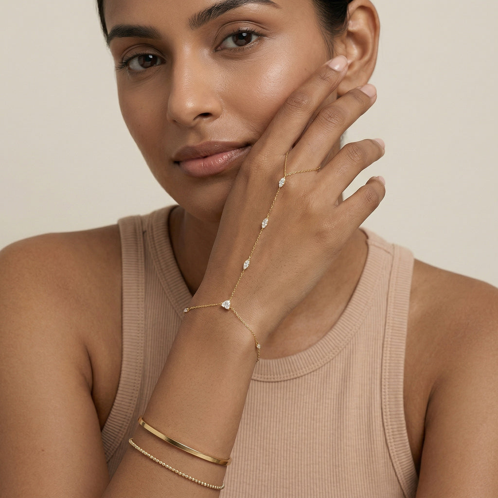 model wearing amethyst & sable luma meridian hand chain in 18k gold