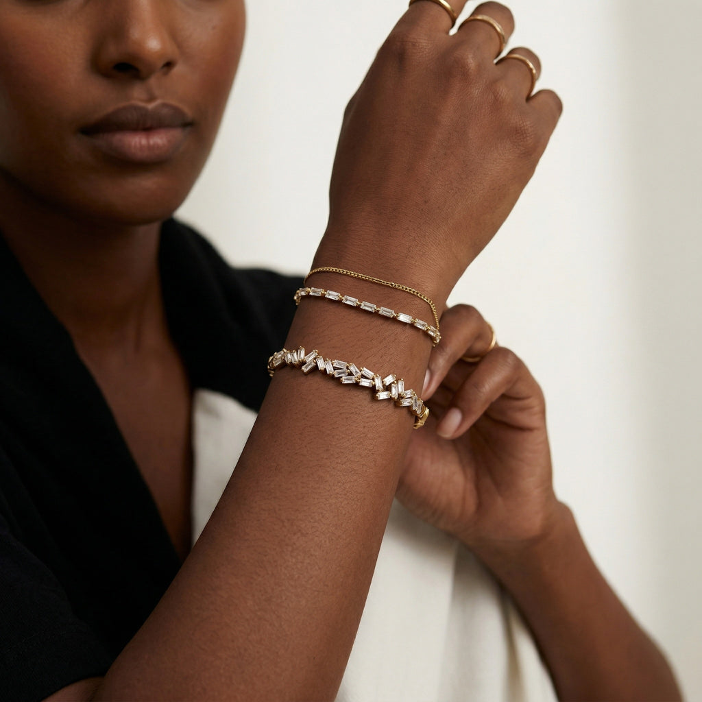 model wearing amethyst & sable luma prism bangle in gold