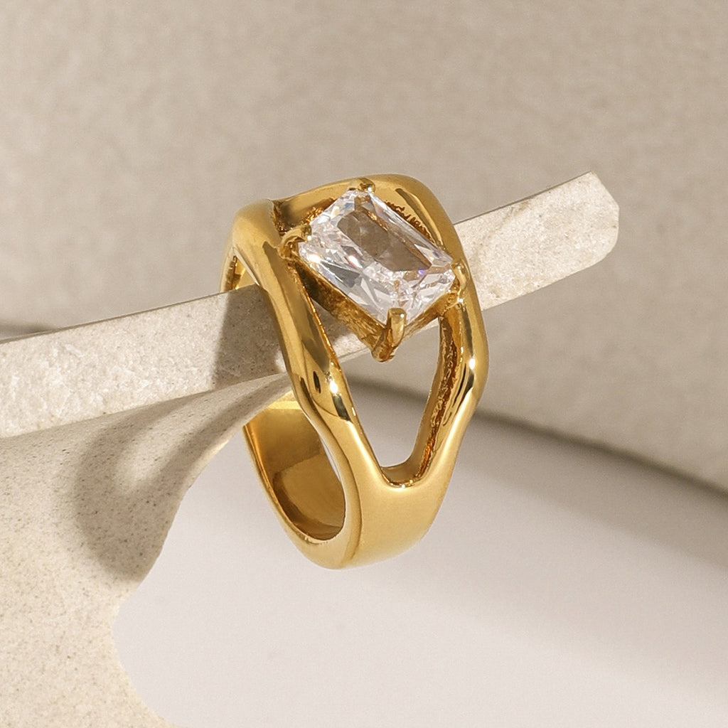 amethyst & sable luma solo ring in gold hanging on soft stone