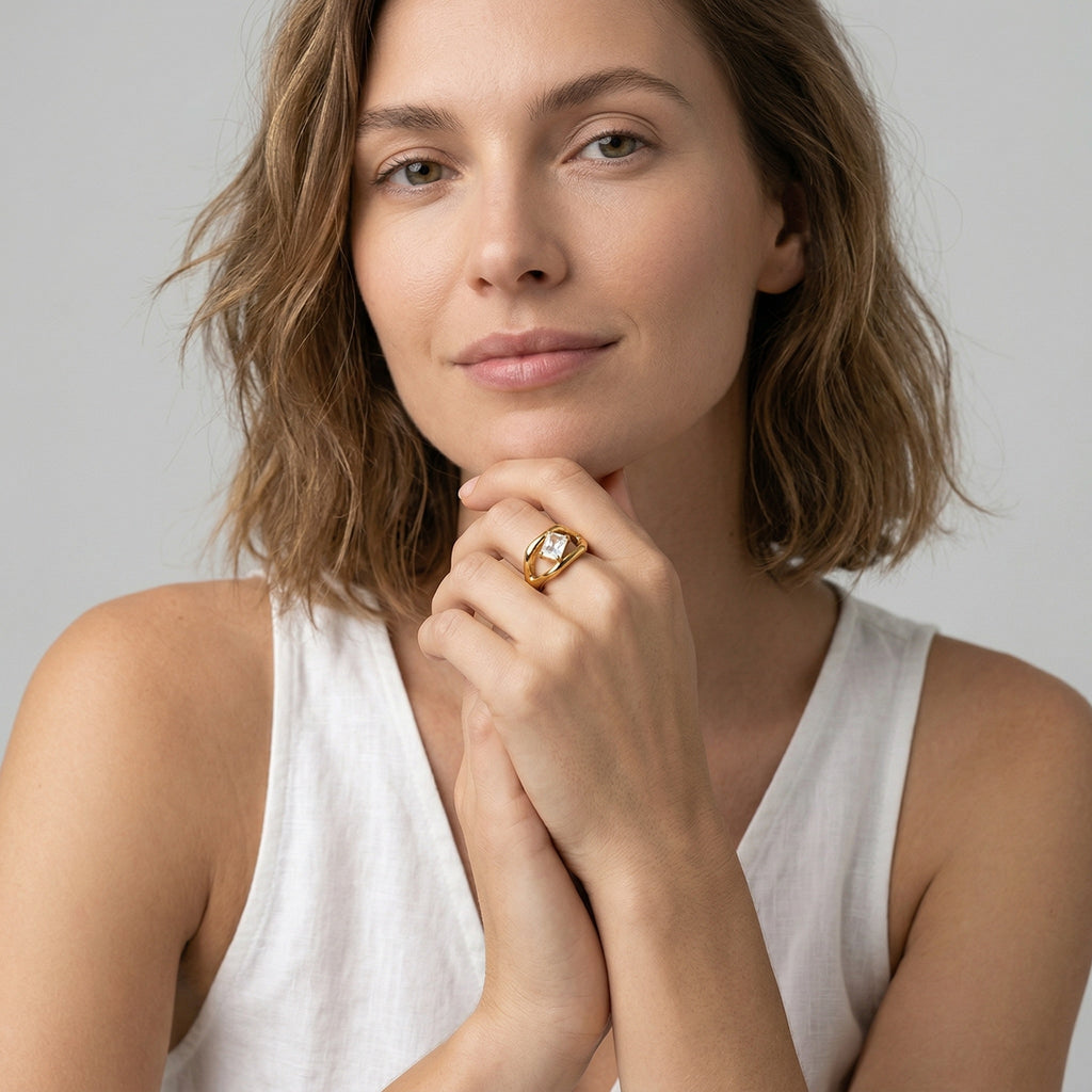 model wearing amethyst & sable luma solo ring in gold
