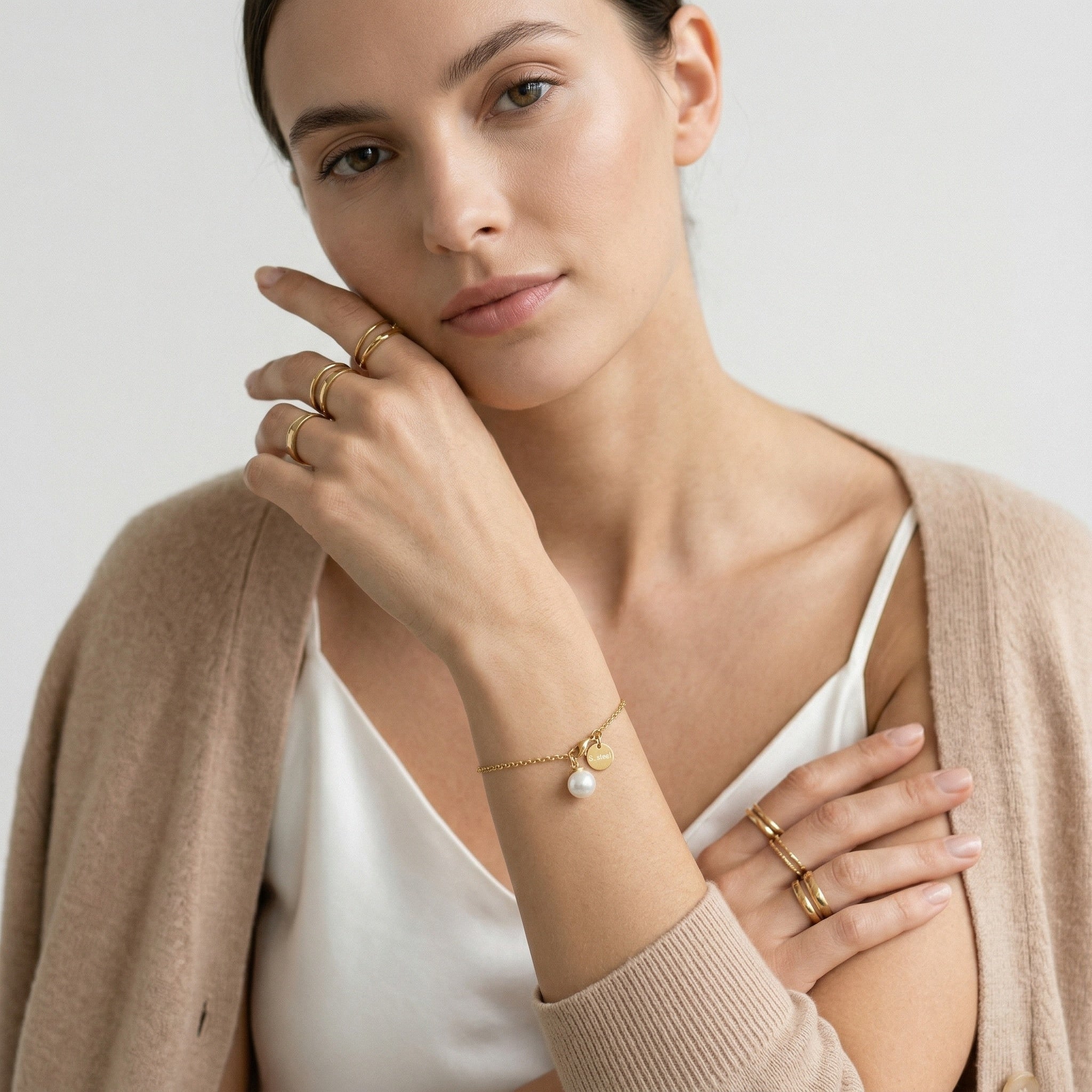 model wearing amethyst & sable selene pearl drop bracelet in gold