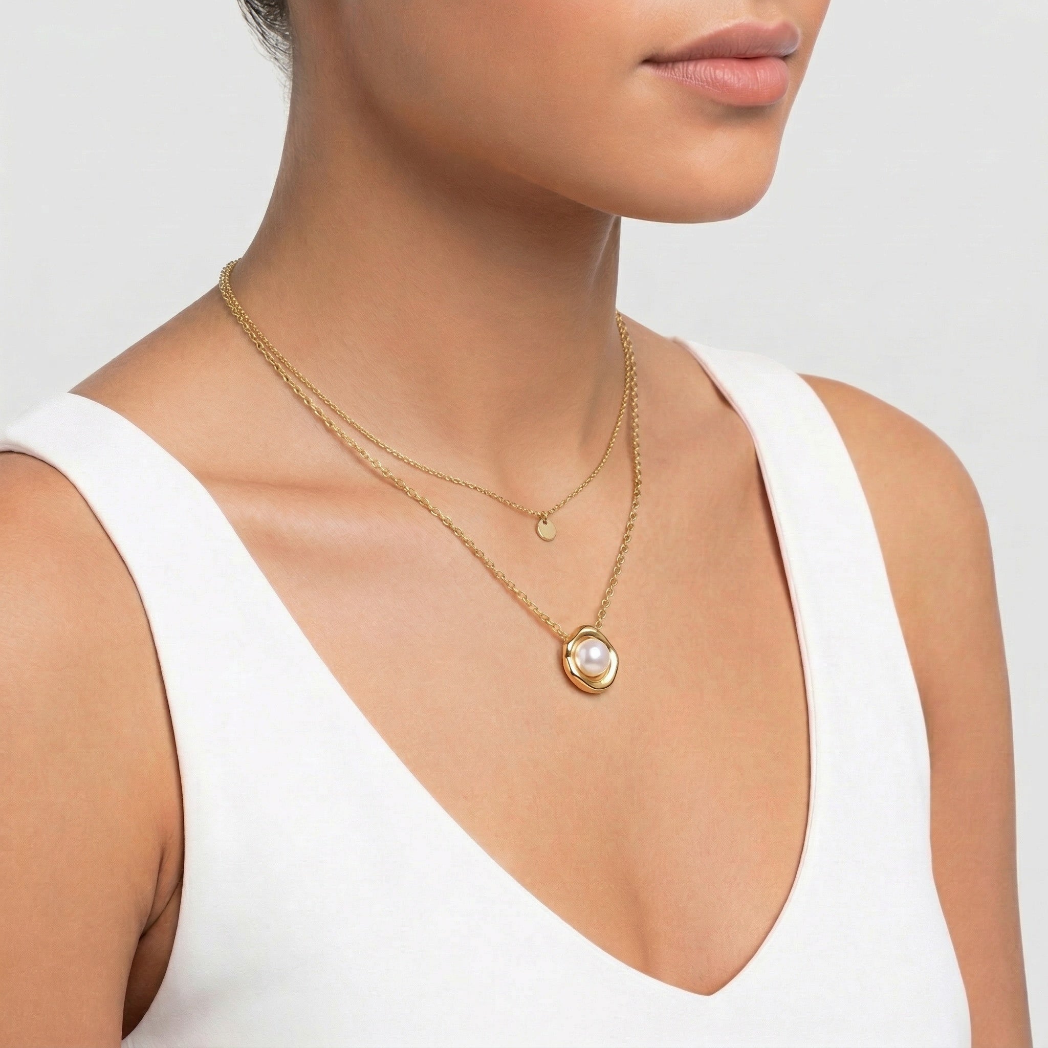 model wearing amethyst & sable selene tide pearl necklace in 18k gold