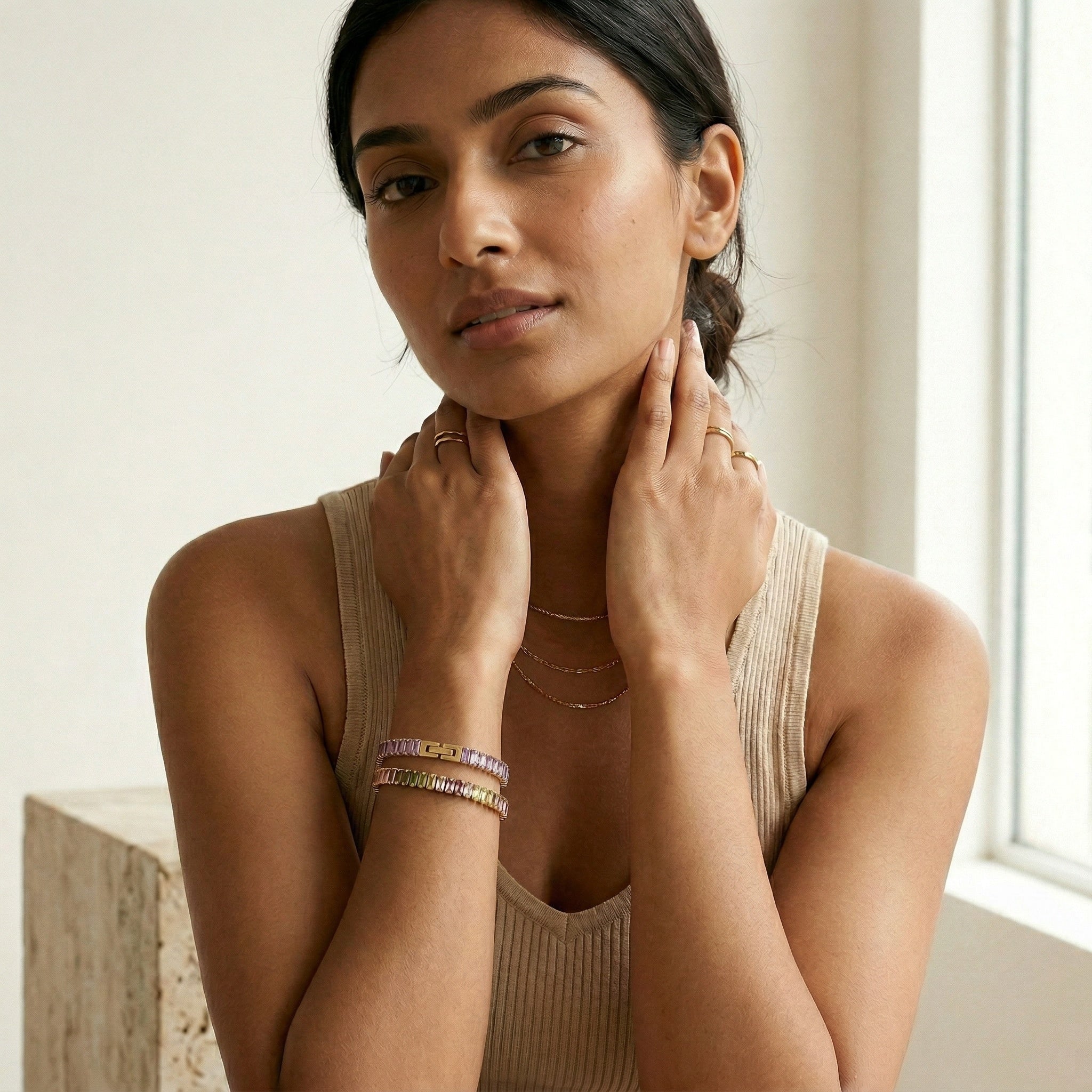 model wearing amethyst & sable soleil prism bracelets in 18k gold opaline and amethyst 