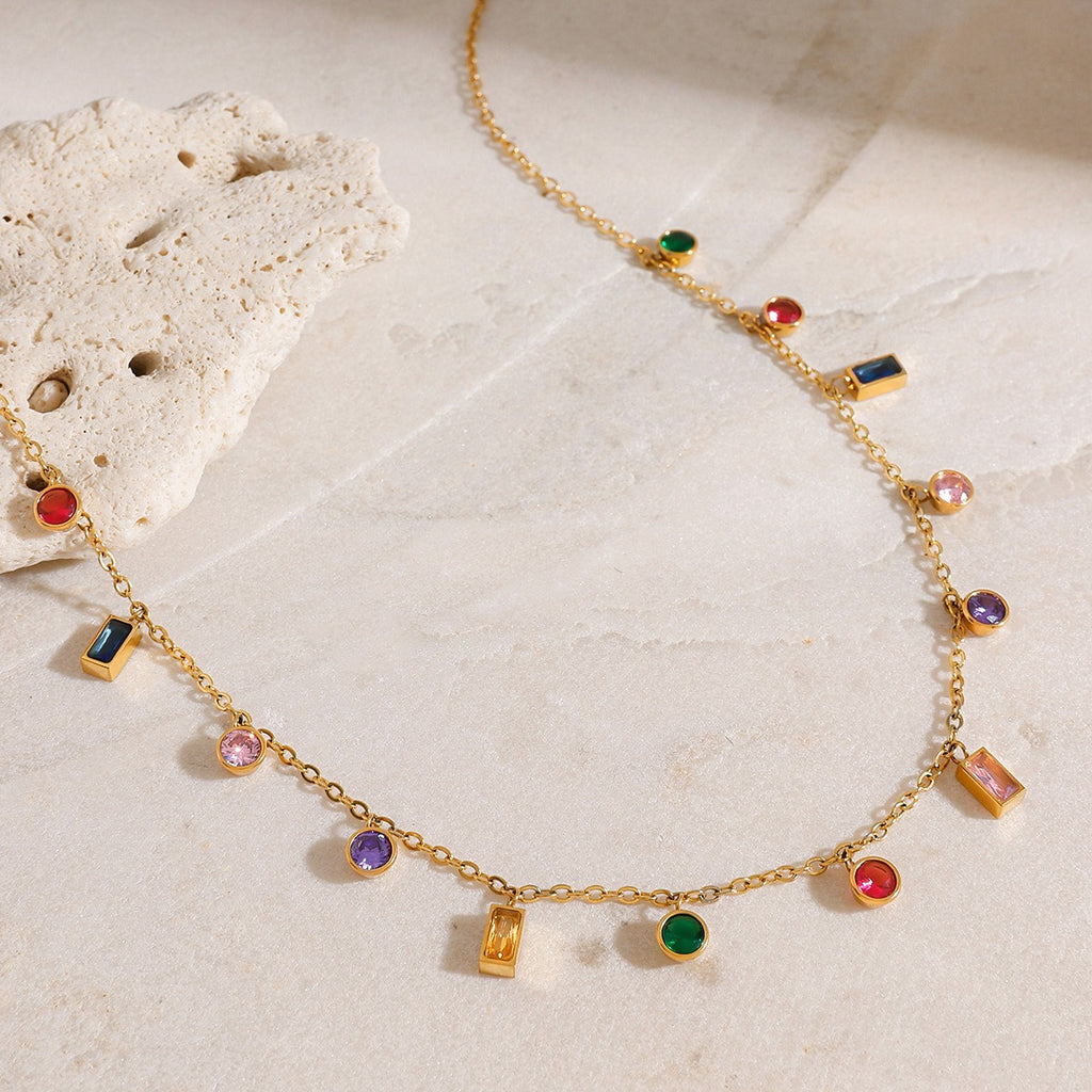 amethyst & sable soleil mosaic necklace in 18k gold on stone surface