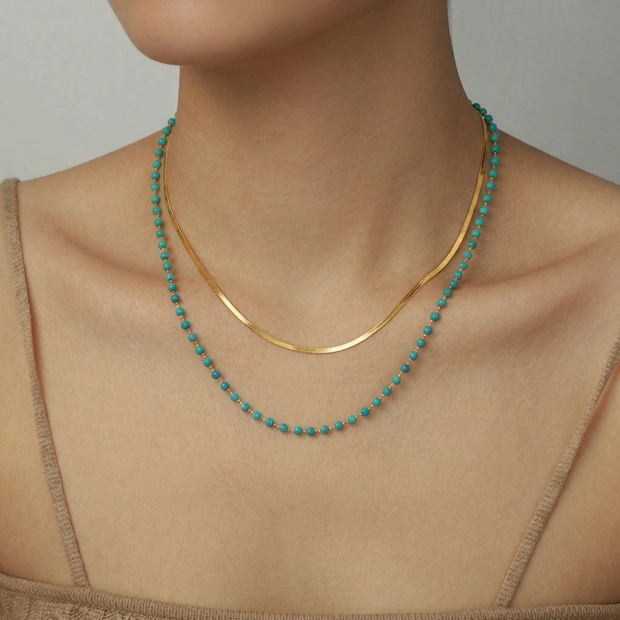 model wearing amethyst & sable calypso azure necklace in 18k gold