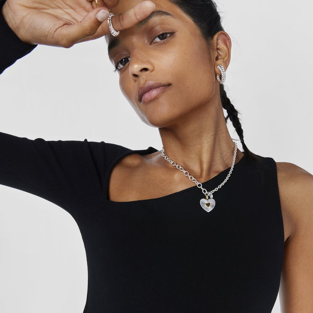 model wearing amethyst & sable aurea devotion necklace with silver and 18k gold heart pendant